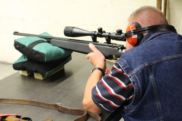 Precision shooting session focusing on firearm safety and handling